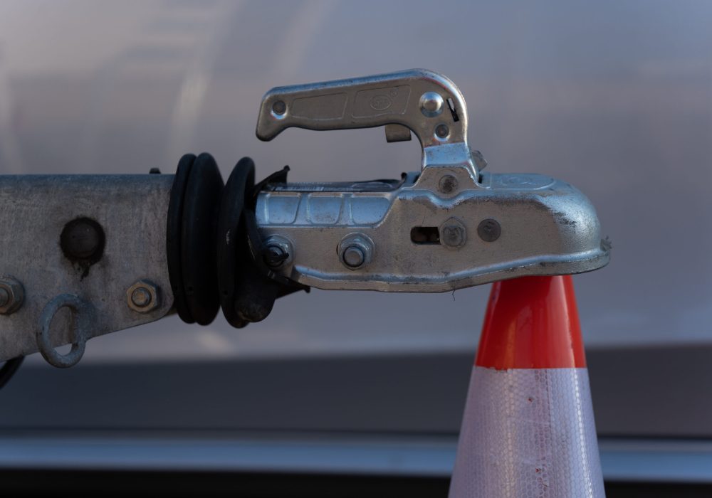 trailer-ball-coupling-leaning-against-traffic-cone-2025-03-09-20-21-02-utc